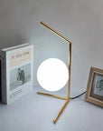 Lampe de chevet design bras dorés & boule de verre - Lampe Chevet Design